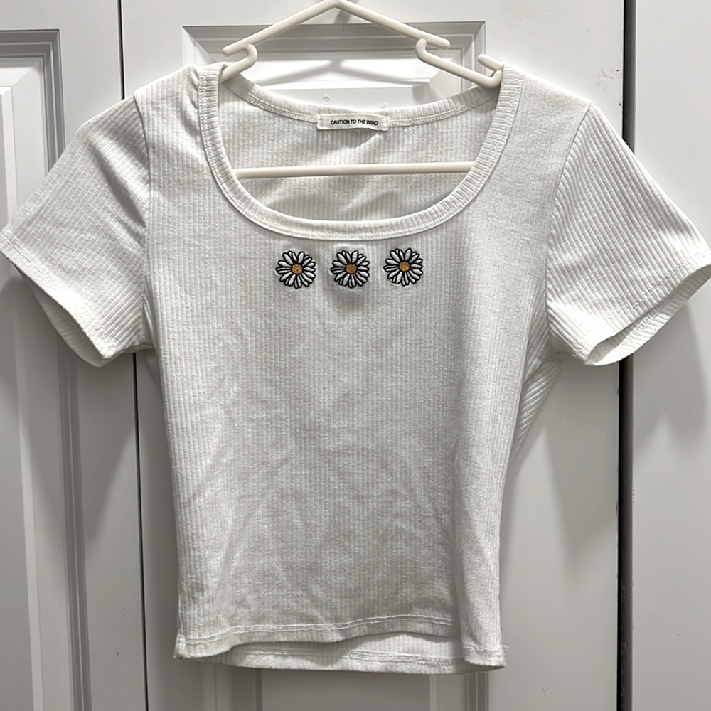 White top with flowers on front